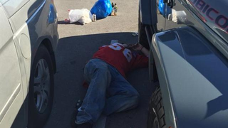 Sad Chiefs Fan Finds A Nice Spot To Lie Down In The Parking Lot